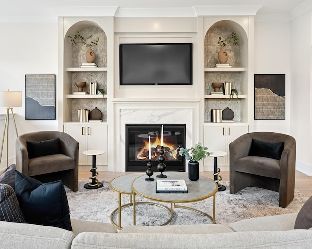 3452 N Bell Ave, Chicago, IL 60618 - living room featuring built in features, ornamental molding, wood finished floors, and a premium fireplace