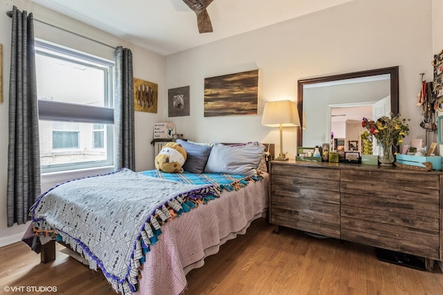 bedroom with wood finished floors and ceiling fan
