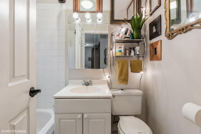 bathroom with toilet, bathing tub / shower combination, and vanity