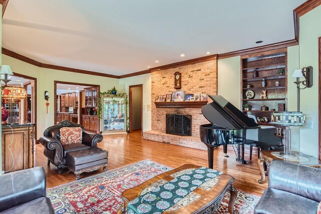 37418 N Fox Hill Dr, Wadsworth, IL 60083 - living room with a fireplace, wood finished floors, and ornamental molding