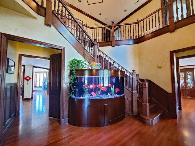 37418 N Fox Hill Dr, Wadsworth, IL 60083 - interior space with lofted ceiling, a wainscoted wall, wood finished floors, and crown molding