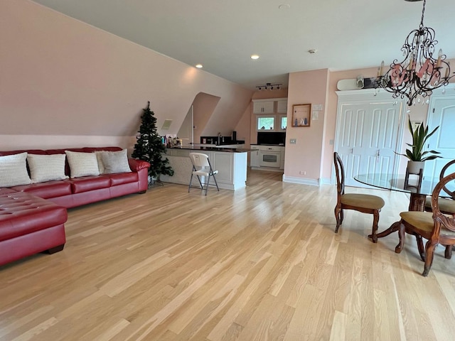 37418 N Fox Hill Dr, Wadsworth, IL 60083 - living room featuring a chandelier, light wood-type flooring, baseboards, and recessed lighting
