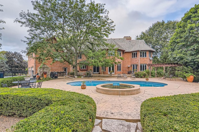 37418 N Fox Hill Dr, Wadsworth, IL 60083 - view of swimming pool featuring a pergola, a pool with connected hot tub, a patio, and fence