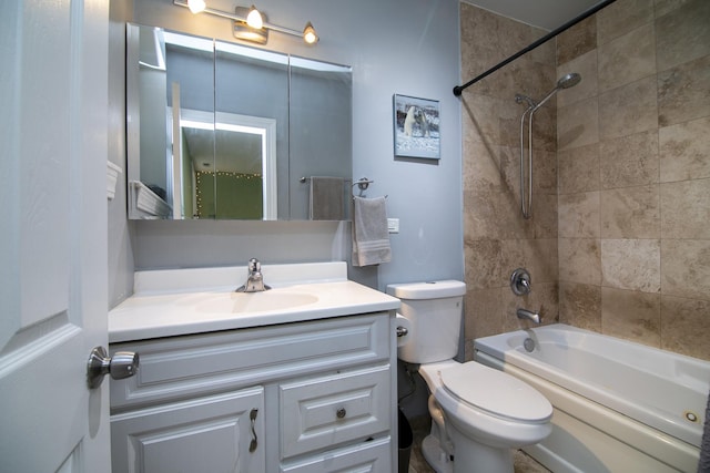 bathroom featuring shower / bathtub combination, vanity, and toilet