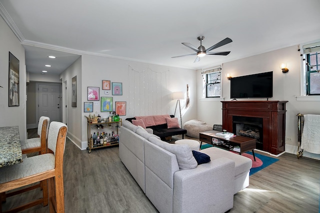 living room featuring wood finished floors, a fireplace, recessed lighting, and ceiling fan