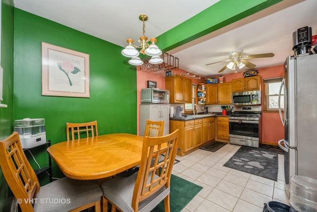 1216 Maple St, Lake In The Hills, IL 60156 - dining area with ceiling fan, light tile patterned floors, and a chandelier