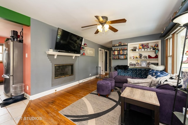 1216 Maple St, Lake In The Hills, IL 60156 - living area with ceiling fan, a fireplace, baseboards, and wood finished floors