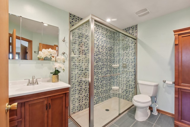full bathroom featuring vanity, tile patterned floors, toilet, a stall shower, and visible vents