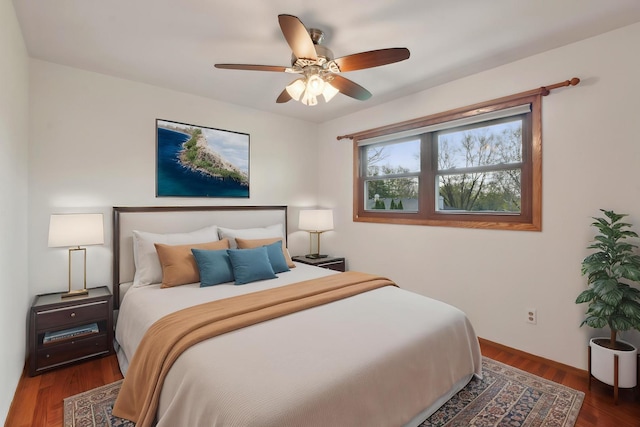 bedroom with wood finished floors and a ceiling fan