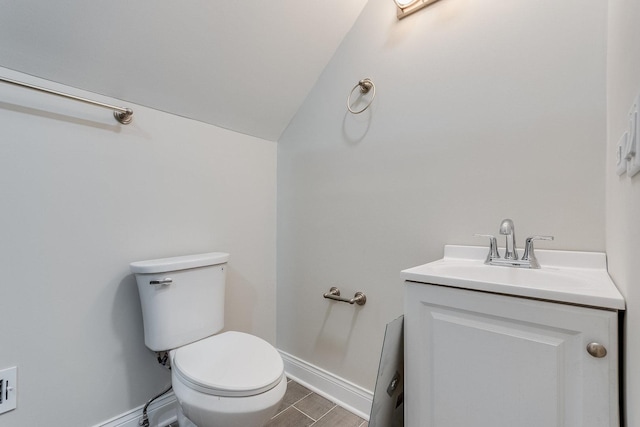 7740 S Vernon Ave, Chicago, IL 60619 - half bath featuring lofted ceiling, baseboards, toilet, and vanity