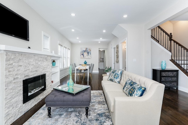 7740 S Vernon Ave, Chicago, IL 60619 - living area featuring baseboards, a stone fireplace, wood finished floors, and stairway