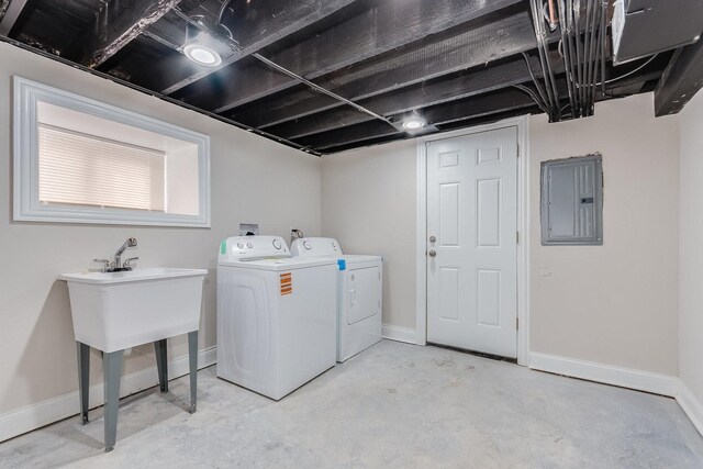 7740 S Vernon Ave, Chicago, IL 60619 - clothes washing area with electric panel, washing machine and clothes dryer, and baseboards