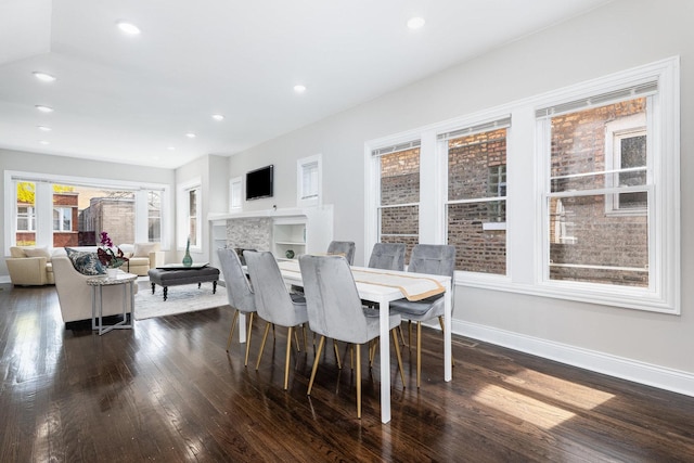 7740 S Vernon Ave, Chicago, IL 60619 - dining space with a fireplace, baseboards, recessed lighting, and dark wood-style flooring