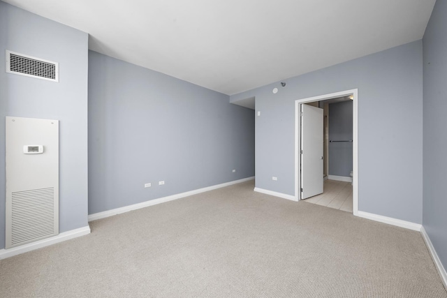 33 W Ontario St Unit 46A, Chicago, IL 60654 - spare room featuring light carpet, visible vents, and baseboards