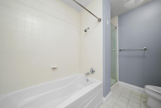33 W Ontario St Unit 46A, Chicago, IL 60654 - bathroom featuring tile patterned flooring, toilet, a bathing tub, baseboards, and walk in shower