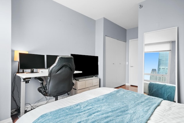 33 W Ontario St Unit 46A, Chicago, IL 60654 - bedroom featuring baseboards and wood finished floors