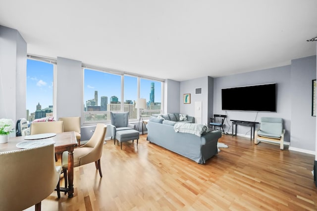 33 W Ontario St Unit 46A, Chicago, IL 60654 - living room featuring plenty of natural light, light wood-style floors, and a view of city