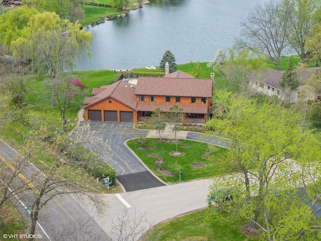 birds eye view of property featuring a water view