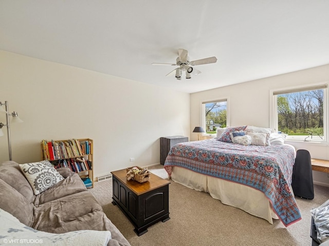 carpeted bedroom featuring a ceiling fan