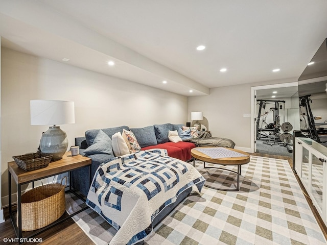 living room with recessed lighting, baseboards, and wood finished floors