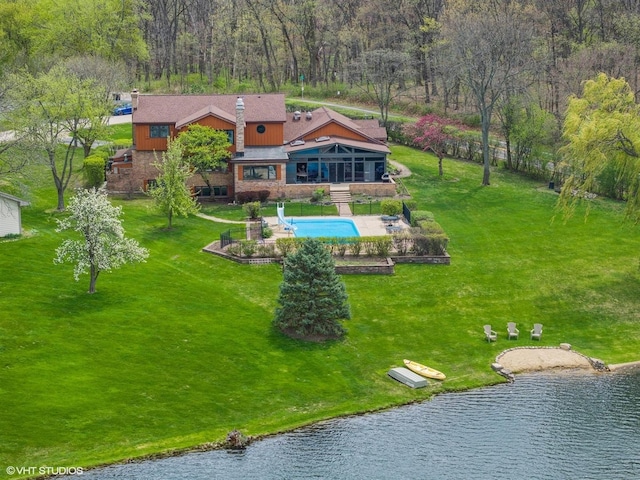 bird's eye view featuring a water view and a view of trees