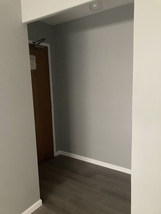 6300 N Sheridan Rd Unit 517, Chicago, IL 60660 - spare room with baseboards and dark wood-style flooring