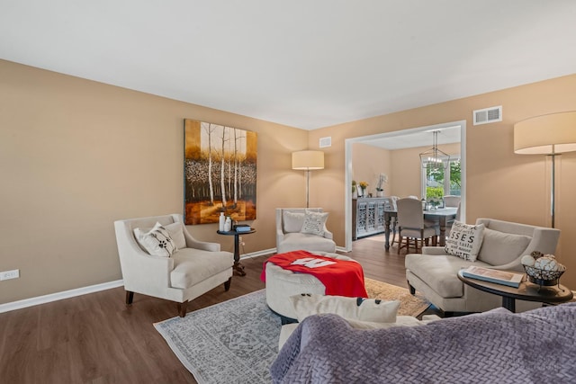 living room with wood finished floors and baseboards