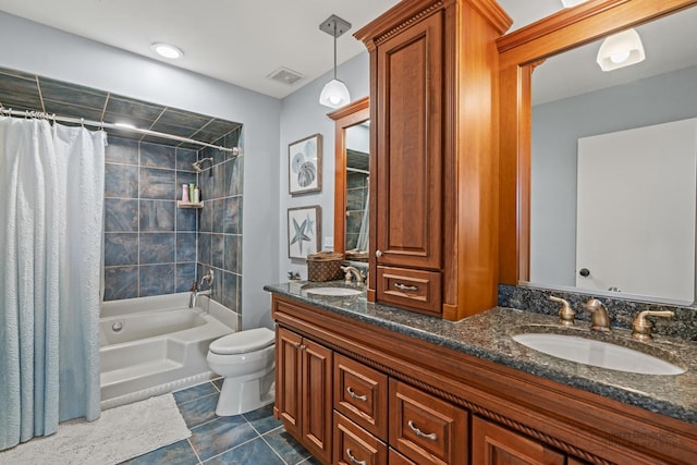 bathroom featuring toilet, shower / tub combo with curtain, double vanity, and tile patterned flooring
