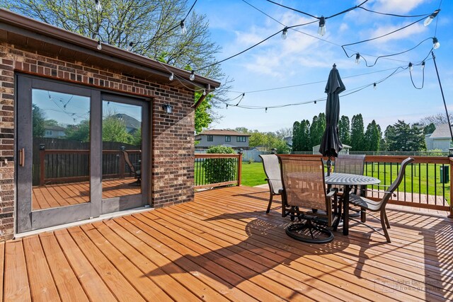 deck featuring outdoor dining area