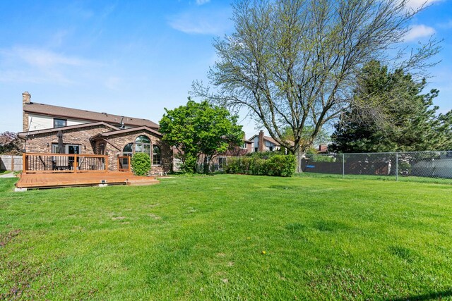 view of yard featuring a wooden deck