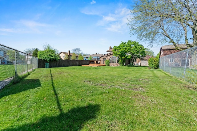 view of yard featuring a wooden deck