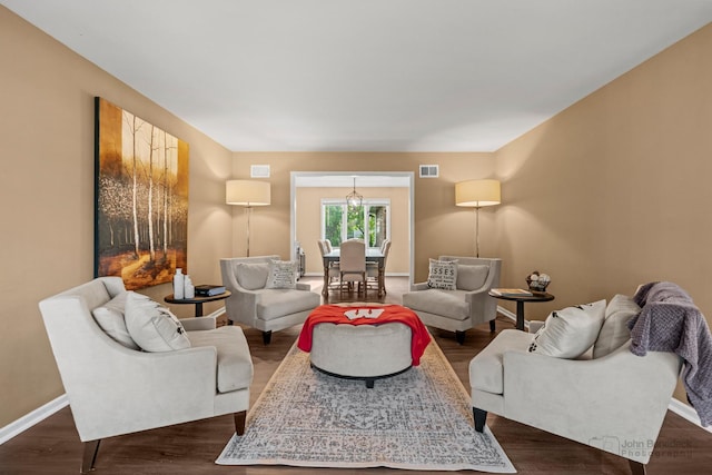 living area featuring baseboards and dark wood-style flooring