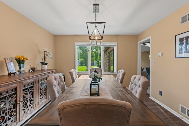 dining area featuring baseboards and wood finished floors