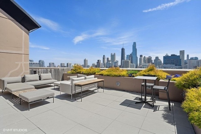 view of patio featuring a city view and an outdoor hangout area