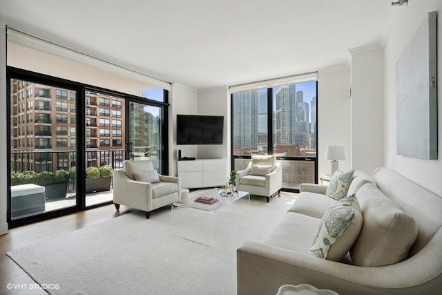 living area with expansive windows and wood finished floors