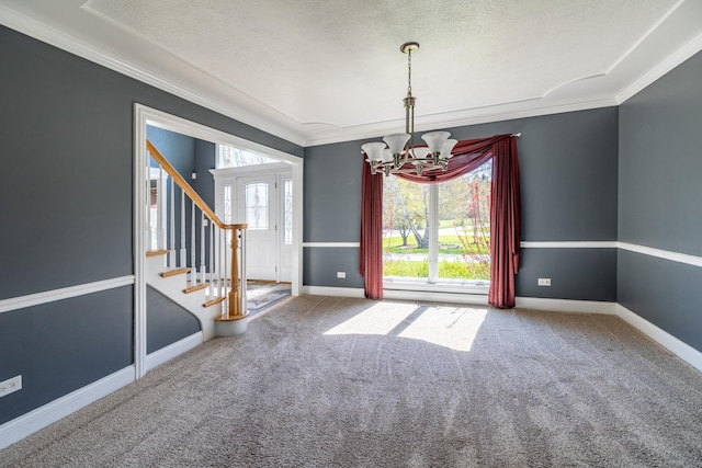 4N481 Citation Ln, Elburn, IL 60119 - unfurnished room with a notable chandelier, a textured ceiling, carpet, and crown molding