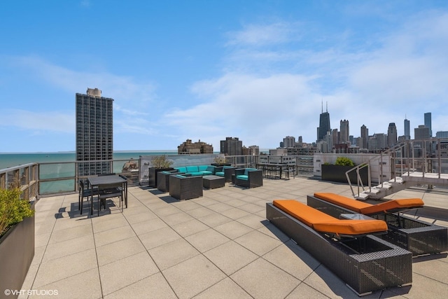view of patio with a water view and an outdoor living space