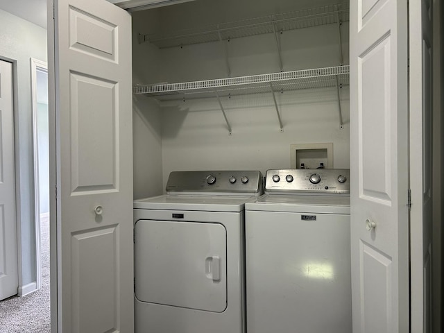 laundry area featuring laundry area, carpet flooring, and washer and dryer
