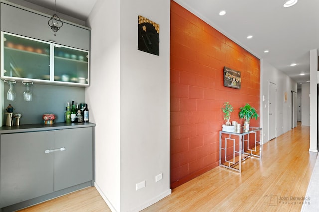 interior space with wood finished floors and recessed lighting