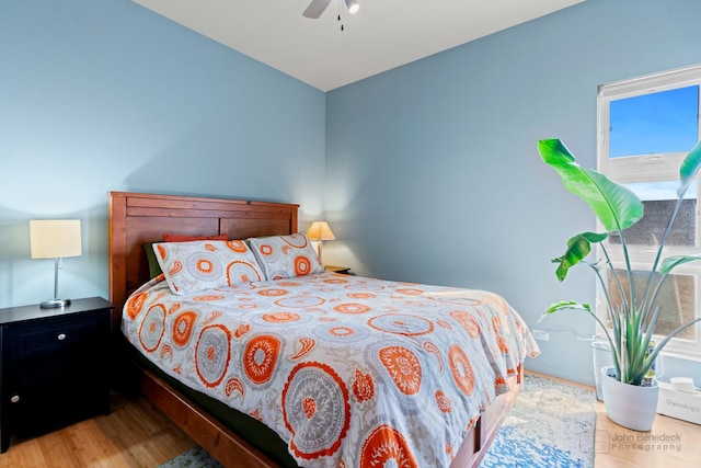 bedroom featuring wood finished floors and ceiling fan