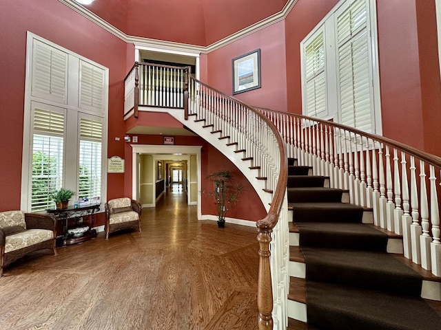 291 Lakeshore Dr, Oswego, IL 60543 - stairway with wood finished floors, baseboards, and a towering ceiling