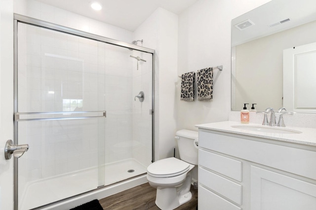 291 Lakeshore Dr, Oswego, IL 60543 - bathroom with a stall shower, toilet, wood finished floors, and vanity