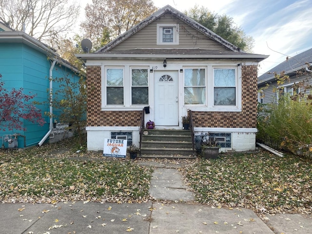 bungalow-style home featuring entry steps