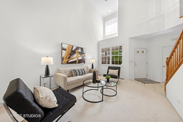 2505 Camberley Cir Unit 3-813, Westchester, IL 60154 - living room with stairway, a towering ceiling, baseboards, and carpet flooring