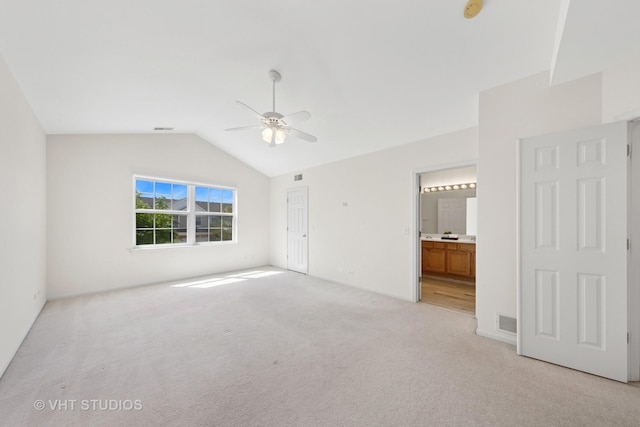 2505 Camberley Cir Unit 3-813, Westchester, IL 60154 - unfurnished bedroom featuring light colored carpet, vaulted ceiling, connected bathroom, baseboards, and a ceiling fan