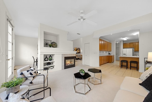 2505 Camberley Cir Unit 3-813, Westchester, IL 60154 - living room featuring ceiling fan and a tiled fireplace