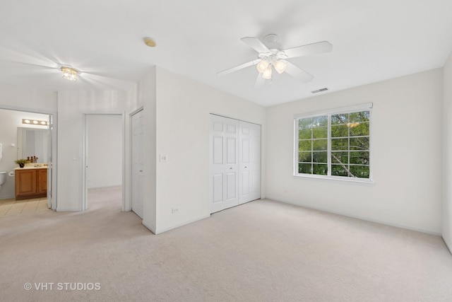 2505 Camberley Cir Unit 3-813, Westchester, IL 60154 - unfurnished bedroom featuring light carpet, a closet, a ceiling fan, ensuite bath, and baseboards