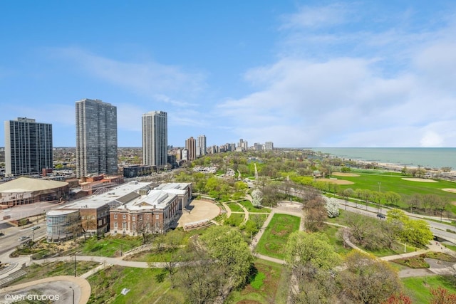birds eye view of property featuring a water view and a city view