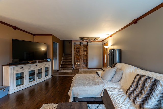 living area featuring wood finished floors, stairs, and ornamental molding
