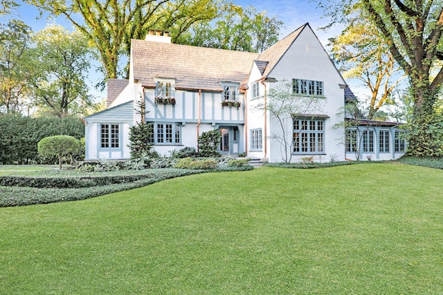 180 De Windt Rd, Winnetka, IL 60093 - rear view of property with a lawn, a chimney, and stucco siding